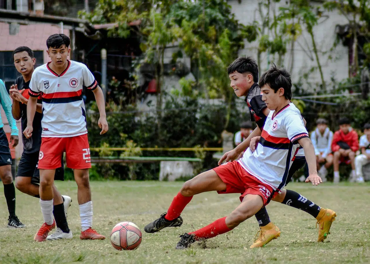 football players fighting for a ball